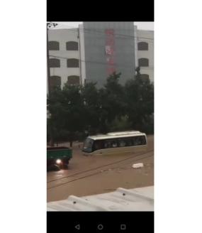 flooded street with vehicles